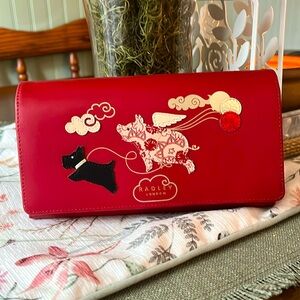 Radley London “If Pigs Could Fly” flap over wallet.